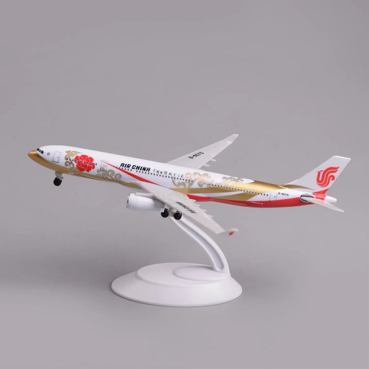 Air China A330 Zijin airliner model on its display stand, side view with red and gold livery