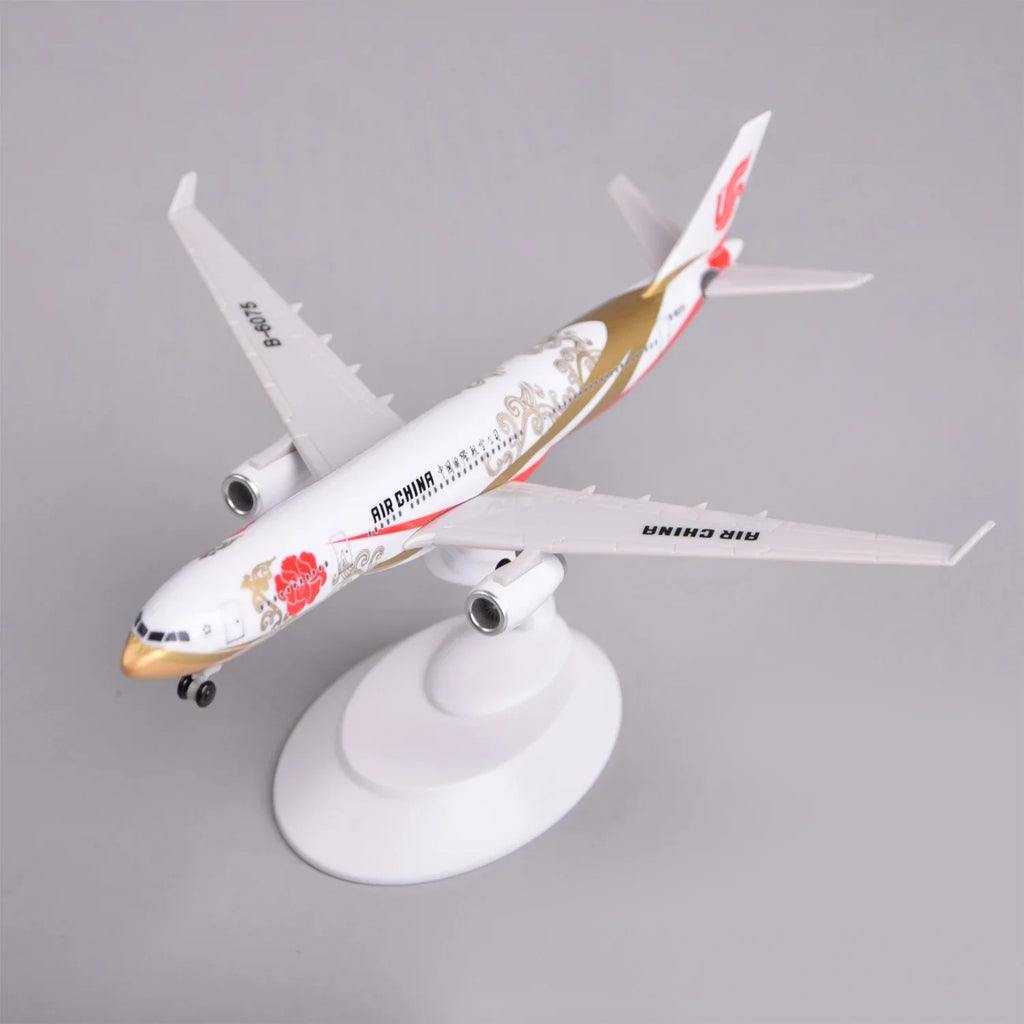 Air China A330 Zijin model plane on its display stand, front three-quarter view of the nose and gold swoosh