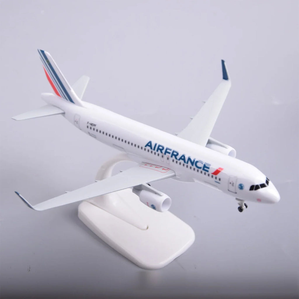 Air France A320 model plane on its display stand, front three-quarter view