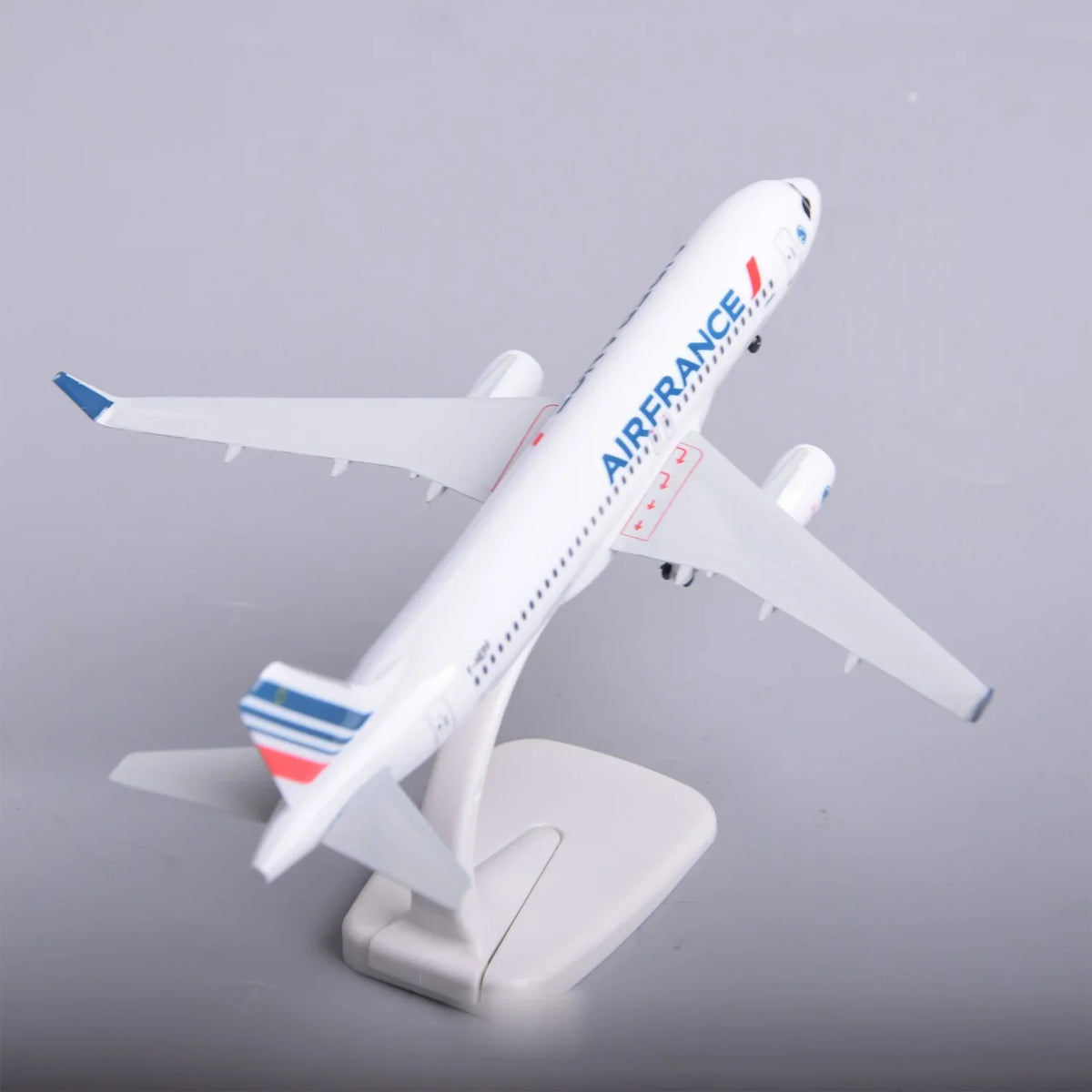 Air France A320 model on its display stand, high rear view showing the tricolor tail