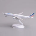 Air France A330 desk model in a climbing takeoff pose on its display stand, side view