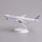 Air France A330 desk model in a climbing takeoff pose on its display stand, side view
