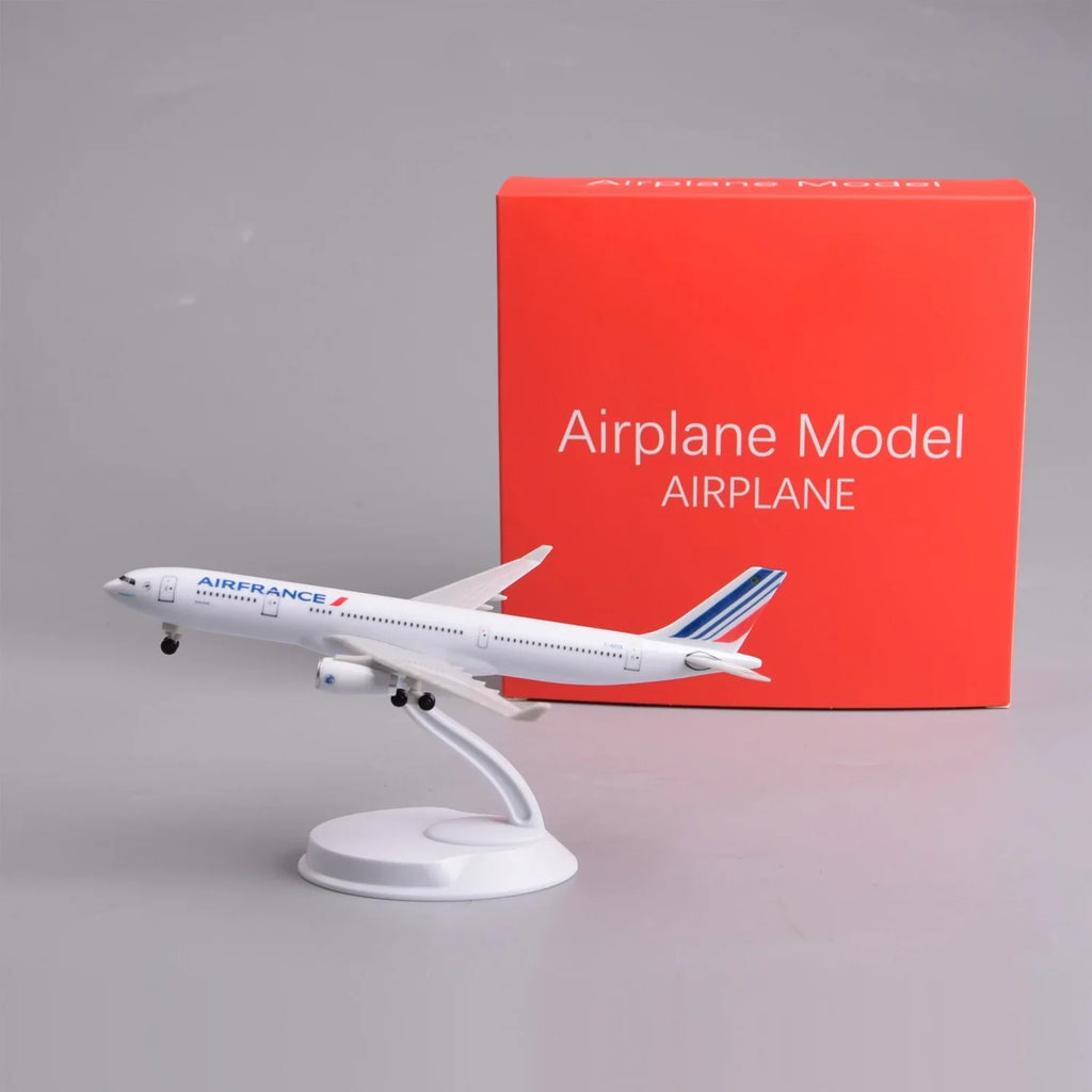 Air France A330 8-inch model on its display stand next to its red gift box