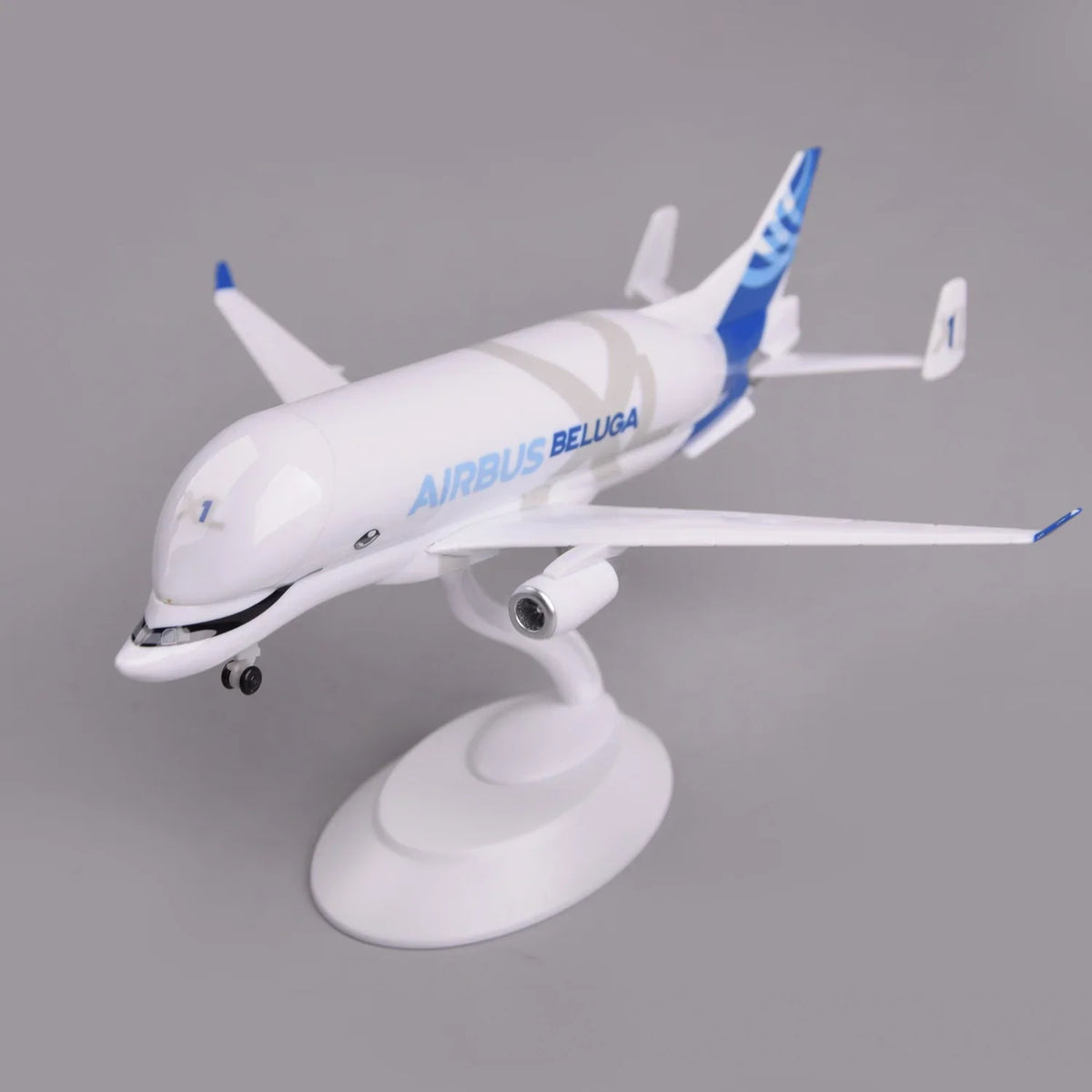 Airbus Beluga XL model on its display stand, front view showing the whale face and painted smile