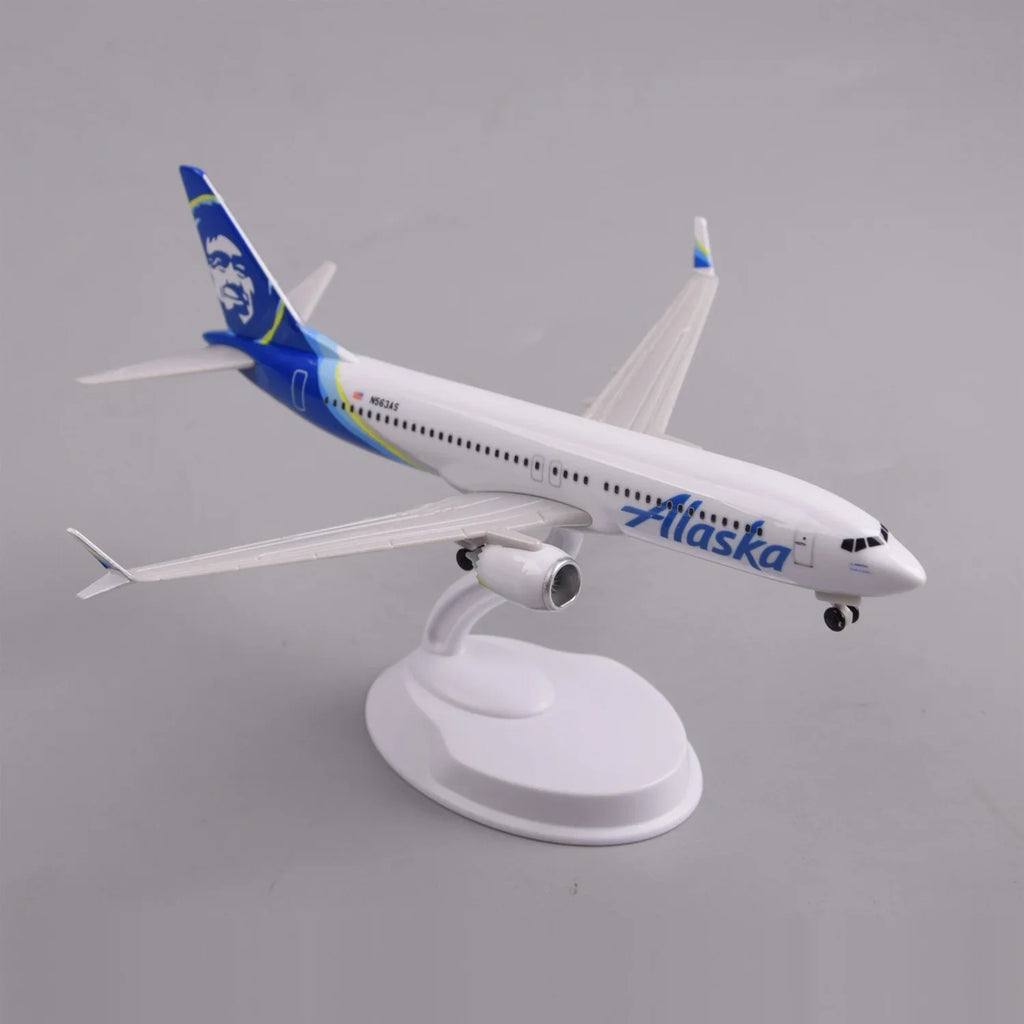 High three-quarter view of the Alaska Airlines 737 MAX 8 model showing the wings and winglets