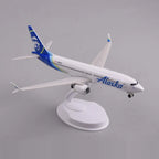 High three-quarter view of the Alaska Airlines 737 MAX 8 model showing the wings and winglets