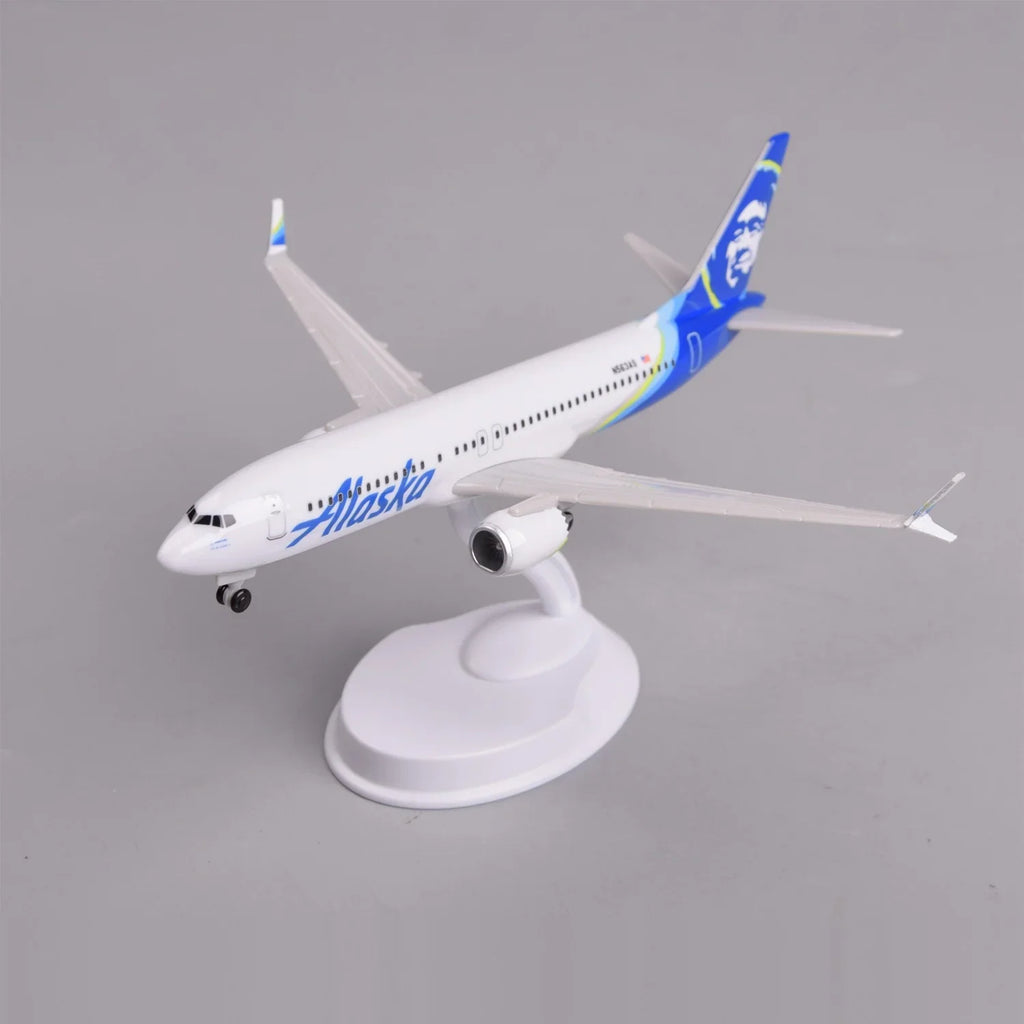 Front three-quarter view of the Alaska Airlines 737 MAX 8 model on its display stand