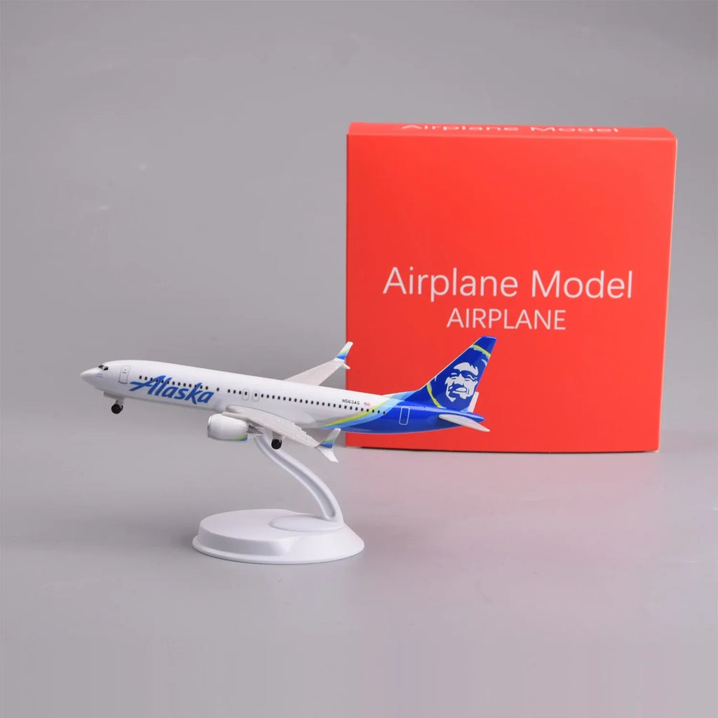 Alaska Airlines 737 MAX 8 8-inch model on its display stand next to its red gift box