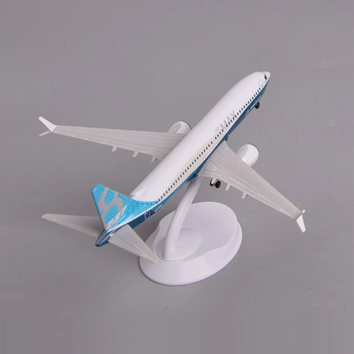 High three-quarter view of the Boeing 737 MAX 8 prototype model showing the wings and teal tail