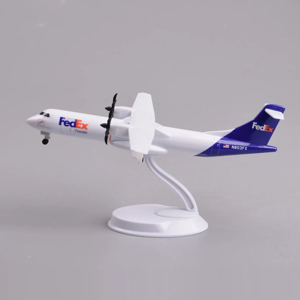 FedEx ATR 72-600 desk model in a climbing pose on its display stand, side view