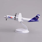 FedEx ATR 72-600 desk model in a climbing pose on its display stand, side view