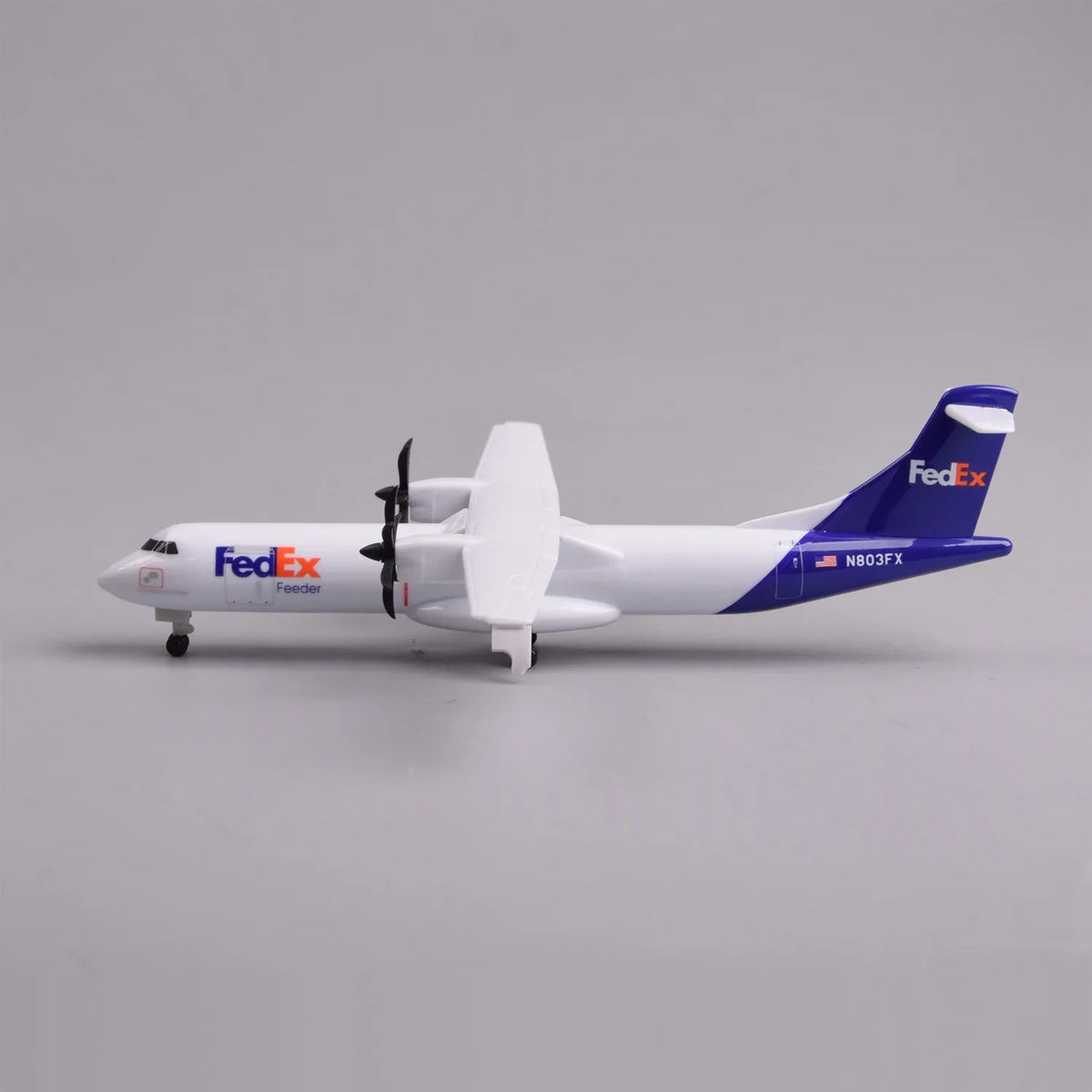 Side profile of the FedEx ATR 72-600 model with landing gear down and purple tail