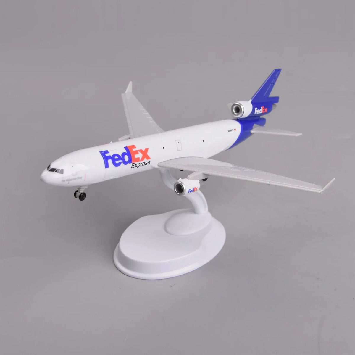 FedEx MD-11 model, Fixed Door version, with a closed fuselage on its display stand
