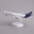 Lufthansa Cargo MD-11 desk model in a climbing takeoff pose on its display stand, side view