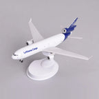 Front three-quarter view of the Lufthansa Cargo MD-11 model on its display stand