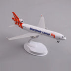 Rear three-quarter view of the Martinair MD-11 model showing the tri-jet orange tail fins