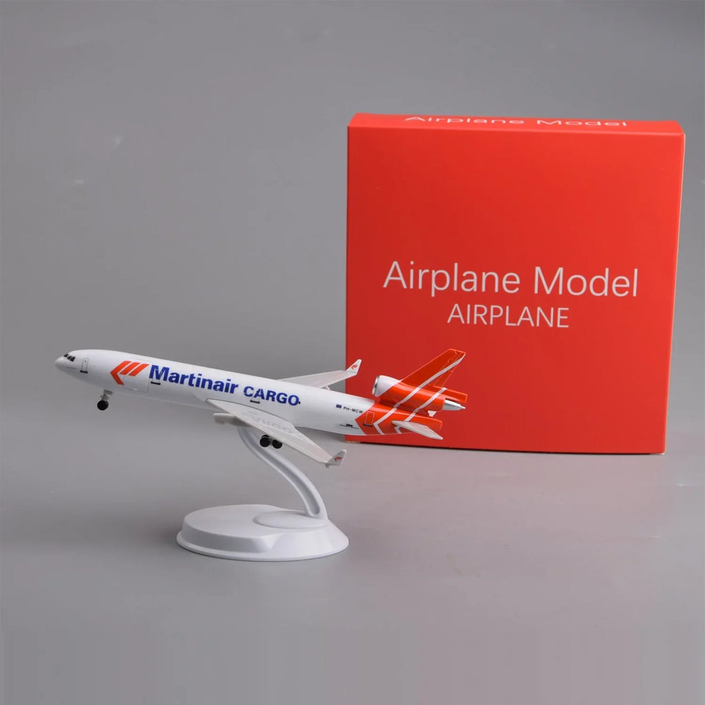 Martinair MD-11 8-inch model on its display stand next to its red gift box