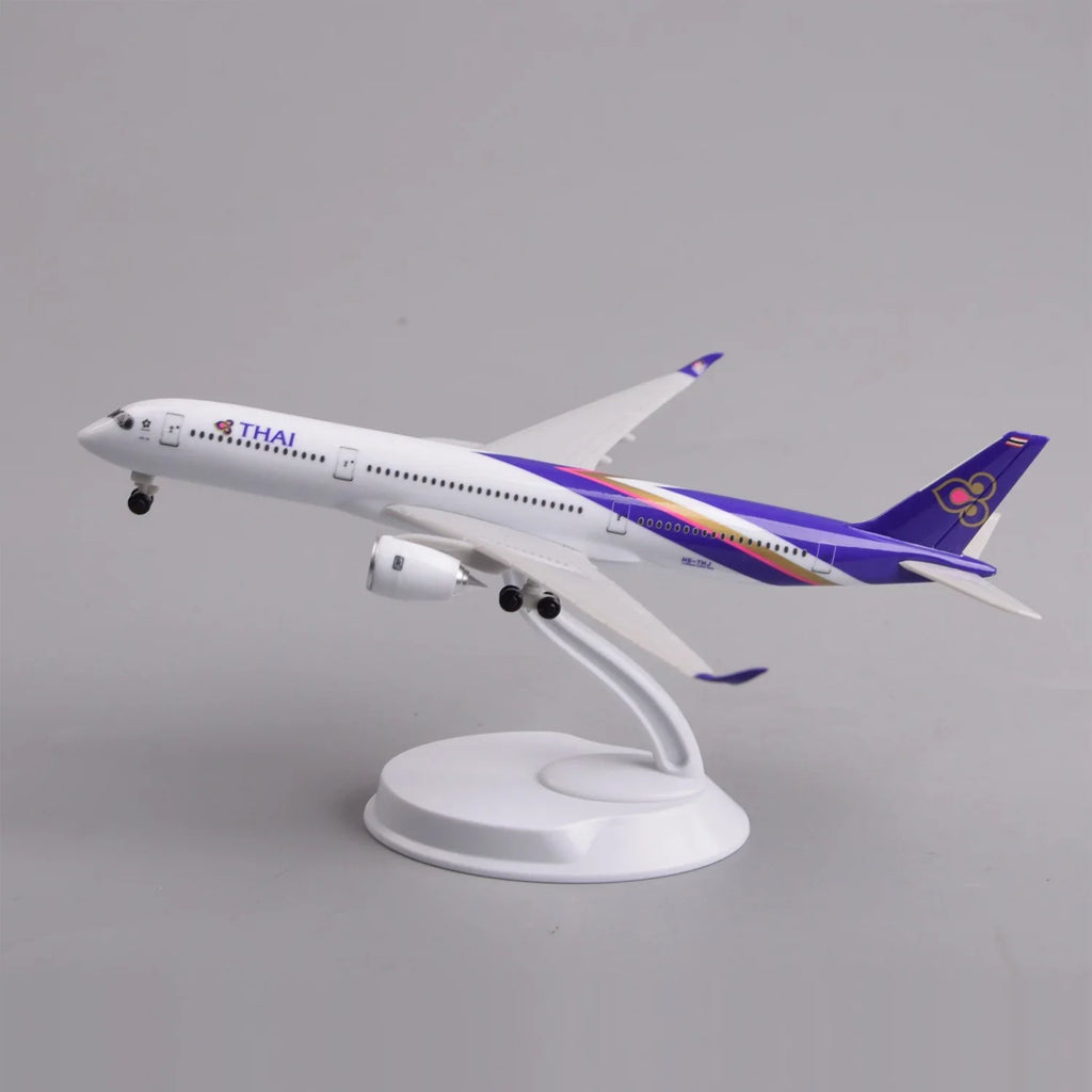 Thai Airways A350 desk model in a climbing takeoff pose on its display stand, side view
