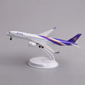 Thai Airways A350 desk model in a climbing takeoff pose on its display stand, side view