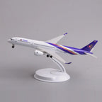 Thai Airways A350 desk model in a climbing takeoff pose on its display stand, side view