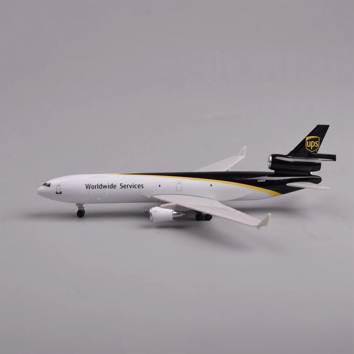 Side profile of the UPS MD-11 scale model showing the tri-jet tail engine and Worldwide Services livery