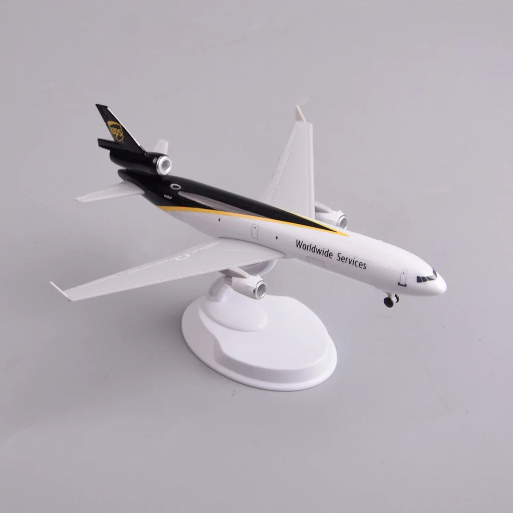 UPS MD-11 freighter model on its display stand, high rear view showing the tail and swept wings