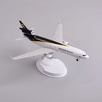 UPS MD-11 freighter model on its display stand, high rear view showing the tail and swept wings