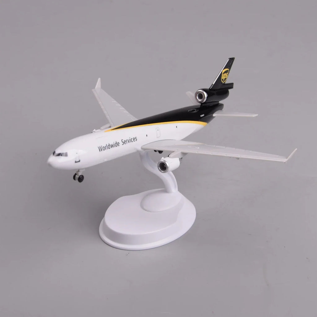 UPS MD-11 cargo jet model on its display stand, front three-quarter view